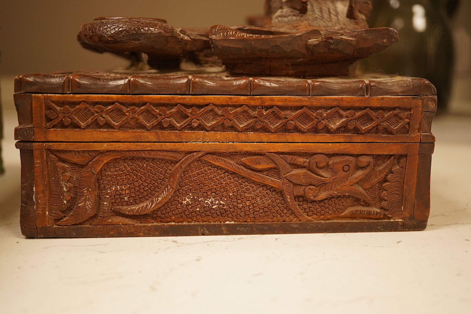 A late 19th century Japanese gilt metal lidded box together with a Burmese carved hardwood box, 28cm wide